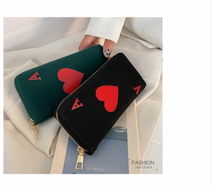 Detail view of stylish long canvas wallet with Ace of Hearts print and metal zipper