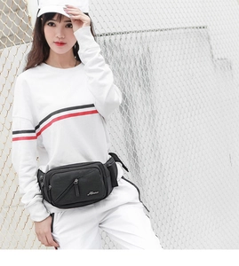 Detail of black sports fanny pack with water bottle holder on a male model