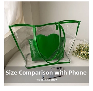 Detailed comparison of green heart-pattern pouch inside clear tote bag with smartphone