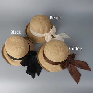 UPF 50+ sun hat with ribbon bow available in beige, black, and coffee straw colors