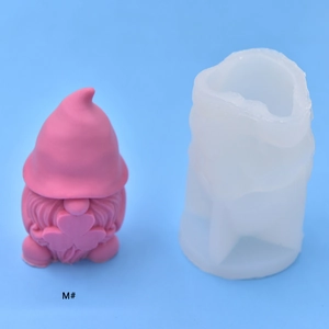 Detail of DIY gnome silicone mold with finished pink gnome holding a heart
