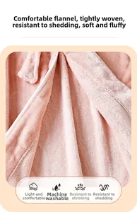 Detail of pink flannel robe showing high-density soft texture and machine washable fabric