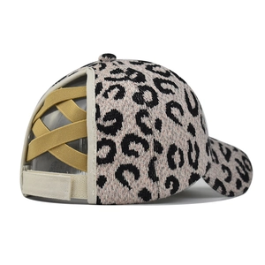 Detail of cross-elastic bands on leopard print ponytail baseball cap for high hair styles