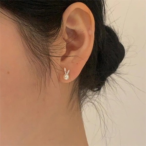 Elegant 925 sterling silver bunny pearl stud earrings shown on model for a cute Korean style