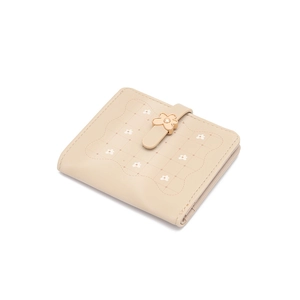 Detail of beige quilted floral short wallet with a golden flower-shaped metal buckle clasp