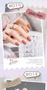 Detail of high-gloss Misty Rose and Mocha Brown nail polish on fingers with a diamond ring