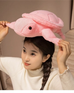 Close-up of cute pink plush turtle showing soft fabric texture and detailed shell stitching