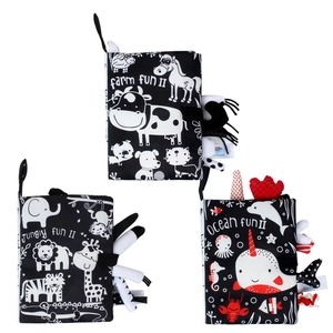 Black and white soft baby cloth books featuring 3D animal tails for sensory stimulation