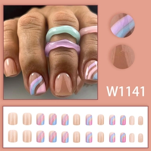 Short square press-on nails with pastel blue and purple wave patterns on nude pink base