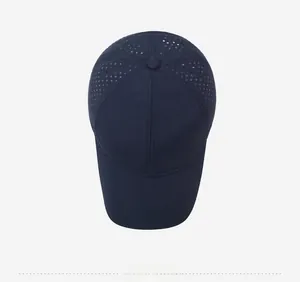 Top view of a navy blue quick-dry baseball cap featuring breathable laser-cut vent holes