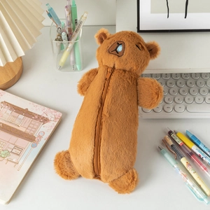 Detail of plush brown capybara pencil case with soft texture and cute embroidery