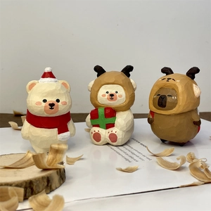 Hand-carved wooden Christmas bears and capybara desk ornaments with festive reindeer hats