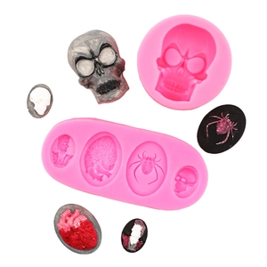 Detailed pink silicone mold for Halloween motifs like skulls, spiders and anatomical hearts
