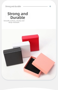 Detailed view of square jewelry boxes with diamond texture and interior sponge padding