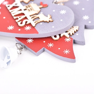 Red heart-shaped wooden Christmas ornament with Xmas text, deer pattern and metal bell