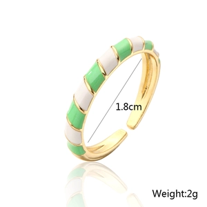 Detail showing 1.8cm diameter and 2g weight of green and white enamel striped gold ring