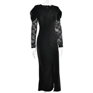 Detail of elegant black long sleeve dress with lace splicing and high slit hemline