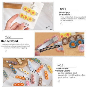 Detail of handmade crochet flower hair clips with fully fabric-wrapped metal duckbill clips