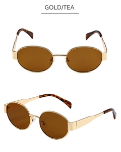 Detailed front and side view of oval gold metal sunglasses with tea tinted lenses