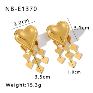 Detail showing dimensions and specifications of 18K gold star and heart drop earrings