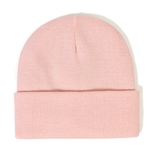 Close-up of soft pink knit texture and fine craftsmanship on this winter beanie