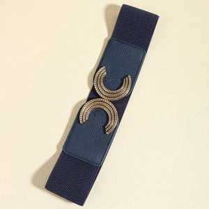 Close-up of interlocking metal buckle with textured engraving on blue elastic belt