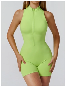 Detail of neon green high-impact athletic bodysuit featuring a sleek front zipper closure