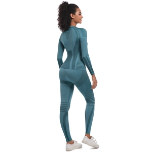 Close-up of teal seamless yoga set showing breathable jacquard texture and knit details