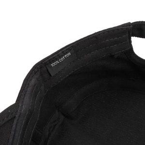 Macro detail of internal stitching and 100% cotton washing label on the tactical cap