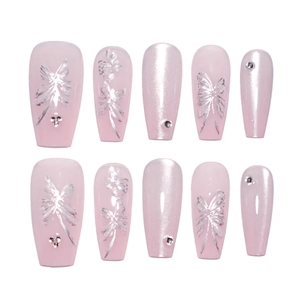Pink cat eye press-on nails with silver butterfly patterns and rhinestones on white background