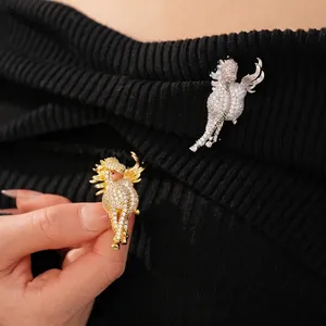 Exquisite gold and silver plated flying horse brooches with white zircon inlay on black fabric