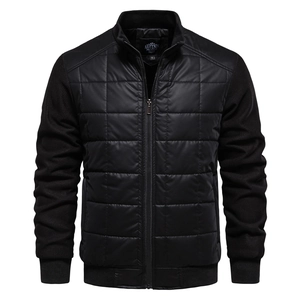 Detail of the stand-up collar, premium brand label, and quilted texture on black jacket