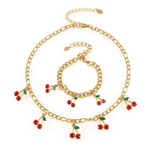 Golden stainless steel jewelry set with red glass cherry pendants, necklace and bracelet