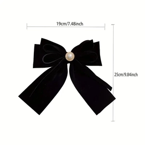 Large black velvet bow hair clip with pearl center decoration and elegant long ribbons