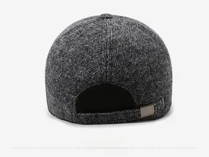 Rear view of men's winter cap showing grey textured fabric and adjustable metal buckle