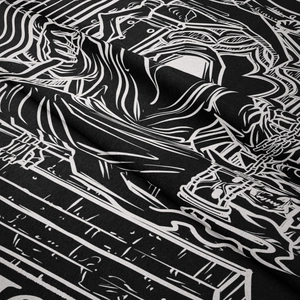 Close-up of bohemian wall tapestry showing fine black and white gothic skull print texture