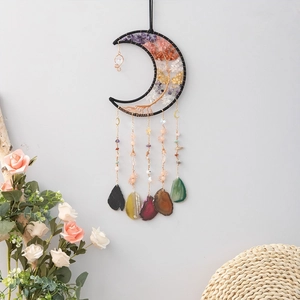 Detail of moon-shaped dream catcher with Tree of Life wire wrap and natural agate slices