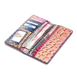 Detail view of colorful crocodile-pattern leather wallet with multiple card slots