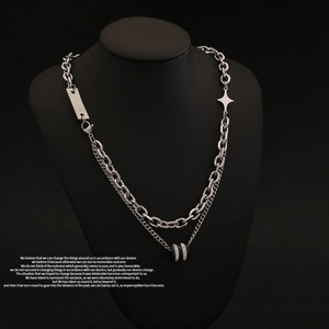Detail of silver double-layer star necklace with pavé ring pendant on black bust