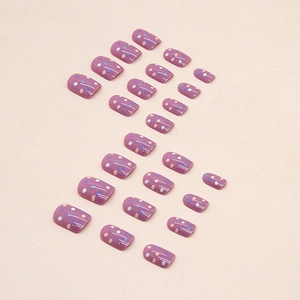 Dark purple press-on nails with colorful polka dots in medium long round shape