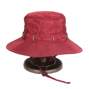 Deep red outdoor sun hat with wide brim, breathable metal vents, and adjustable chin strap