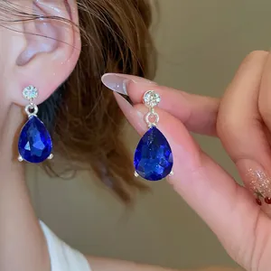 Elegant silver-tone necklace and waterdrop earrings set with deep blue crystals