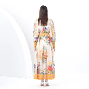 Retro long print dress with stand collar and lantern sleeves shown from a back view