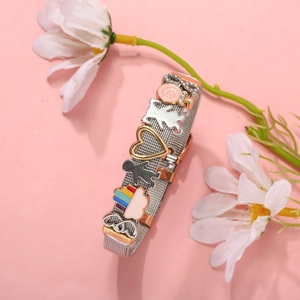 Milanese stainless steel mesh bracelet with colorful enamel charms on pink background