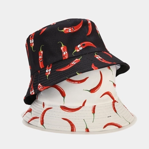 Double-sided bucket hat with red chili patterns in black and white for outdoor sun protection