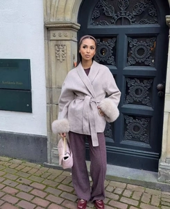 Women's light brown wool coat with faux fur cuffs and matching waist tie belt