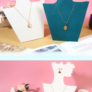 Detail of solid wood jewelry display stands featuring neck busts and silhouette profiles
