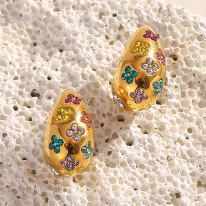 Detailed macro view of 18K gold plated teardrop earrings with colorful crystal flowers