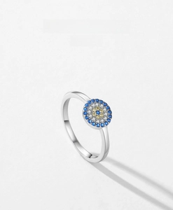 Detailed close-up of S925 sterling silver evil eye ring with blue and yellow pavé crystals