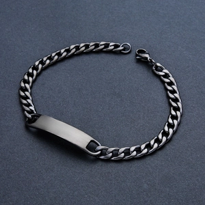 Detailed view of a black stainless steel Cuban link bracelet with a polished engravable plate